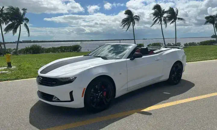 2023 Chevrolet Camaro convertible rental vehicle, top down, Southwest Florida waterfront