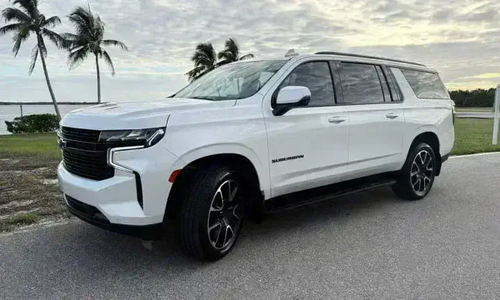2023 Chevrolet Suburban rental vehicle in white, Southwest Florida waterfront